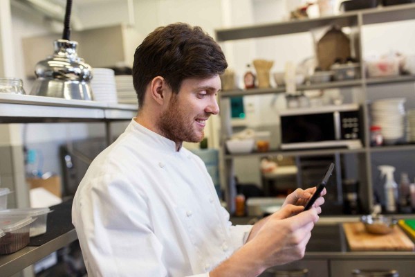 Capitol City Produce Chef in Kitchen with Tablet for Online Ordering